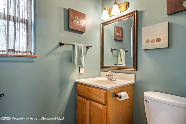 half bath with vanity and toilet