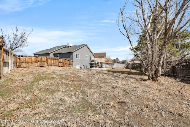 view of yard featuring a fenced backyard
