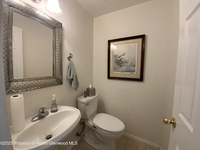 758 Pine Ct, New Castle, CO 81647 - half bath with toilet, baseboards, tile patterned floors, and a sink