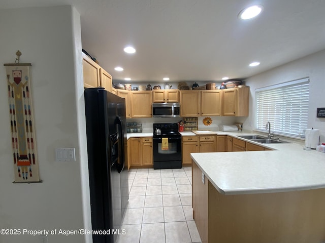 758 Pine Ct, New Castle, CO 81647 - kitchen featuring light tile patterned floors, a sink, a peninsula, black appliances, and light countertops