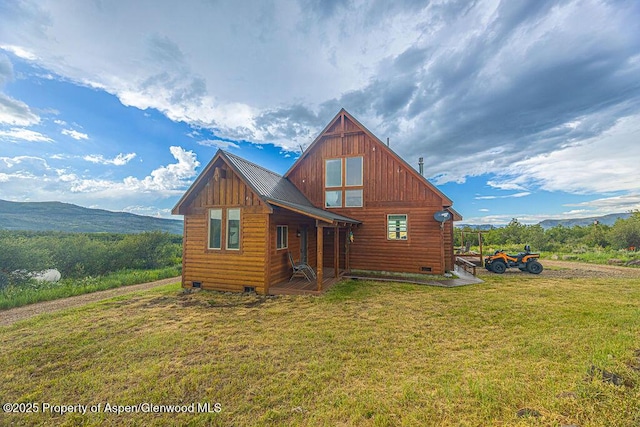 1349 Eagle Loop, Craig, CO 81625 - back of property featuring a yard, board and batten siding, crawl space, and a mountain view