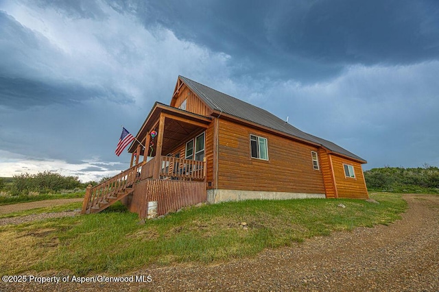 1349 Eagle Loop, Craig, CO 81625 - view of home's exterior with stairway and a porch