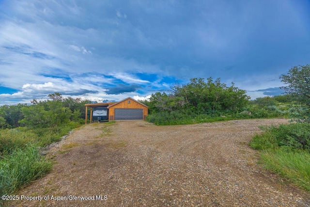 1349 Eagle Loop, Craig, CO 81625 - garage featuring dirt driveway and a garage