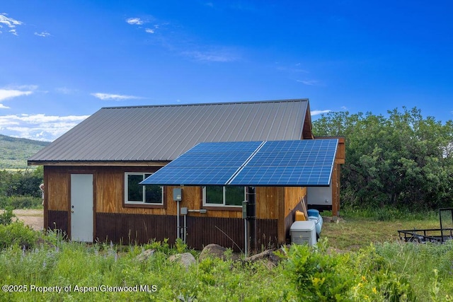 1349 Eagle Loop, Craig, CO 81625 - view of front facade featuring solar panels and metal roof