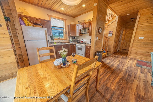 1349 Eagle Loop, Craig, CO 81625 - dining area with wooden walls, wood-type flooring, wooden ceiling, and recessed lighting