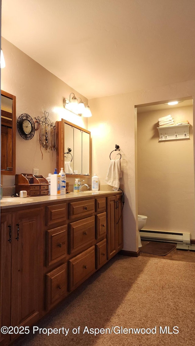 3294 County Road 103, Craig, CO 81625 - hallway featuring baseboards, baseboard heating, and carpet flooring