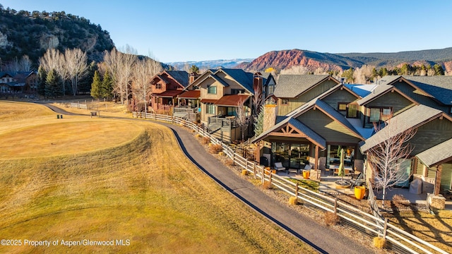 exterior space with a residential view and a mountain view