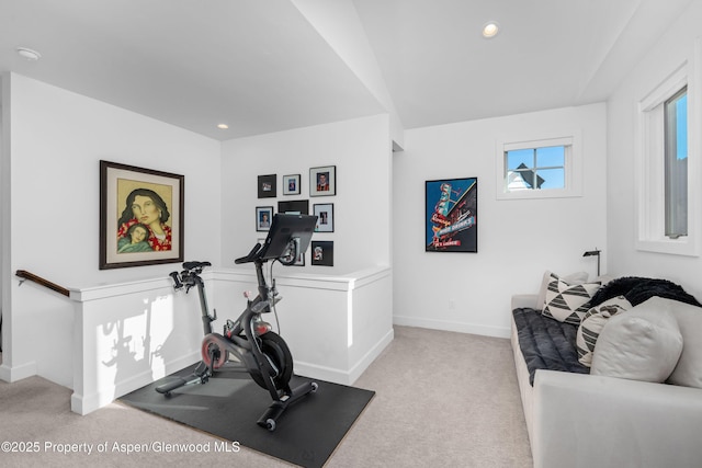 workout room featuring recessed lighting, light colored carpet, and baseboards