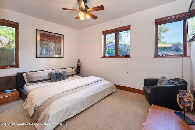 carpeted bedroom with ceiling fan