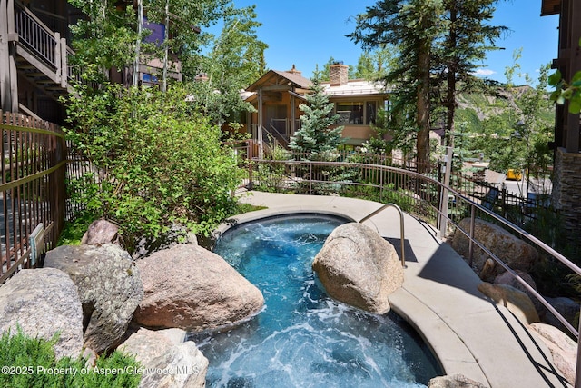 view of pool with pool water feature