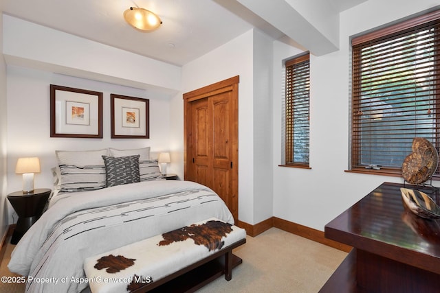 carpeted bedroom featuring a closet