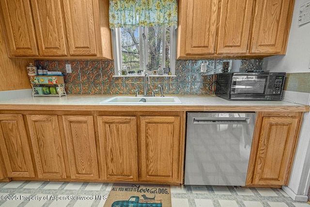 1097 Kowach Dr, Craig, CO 81625 - kitchen with dishwasher, a sink, light countertops, light floors, and tasteful backsplash