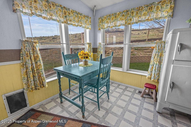 1097 Kowach Dr, Craig, CO 81625 - sunroom / solarium featuring plenty of natural light, tile patterned floors, and wood walls