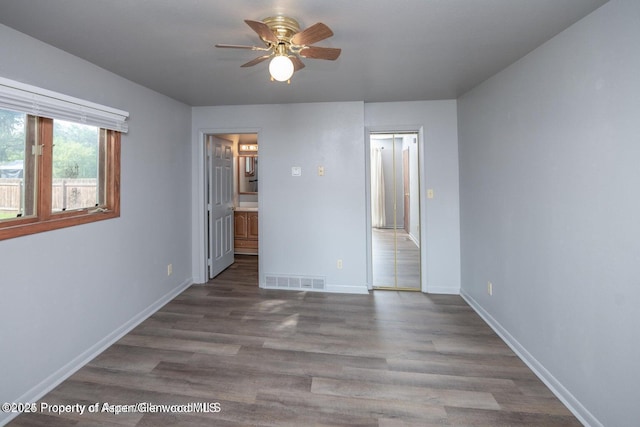 750 Breeze St, Craig, CO 81625 - unfurnished bedroom featuring wood finished floors and ensuite bathroom