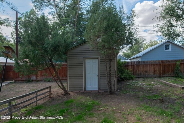 750 Breeze St, Craig, CO 81625 - view of shed with a fenced backyard