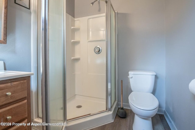 750 Breeze St, Craig, CO 81625 - full bath featuring wood finished floors, a stall shower, and vanity