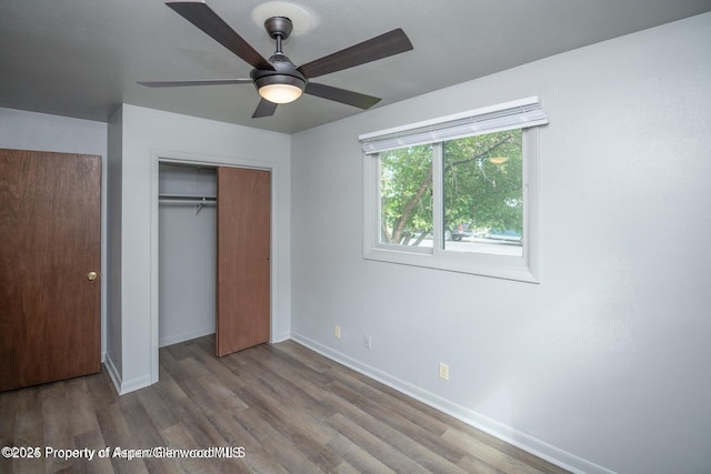750 Breeze St, Craig, CO 81625 - unfurnished bedroom featuring wood finished floors, a closet, and a ceiling fan