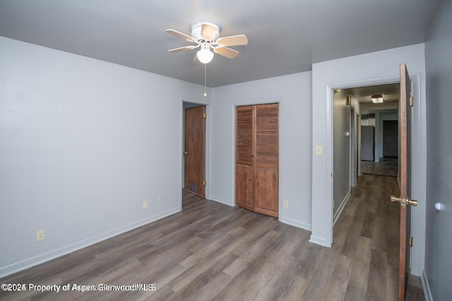 750 Breeze St, Craig, CO 81625 - unfurnished bedroom with wood finished floors, a closet, and ceiling fan