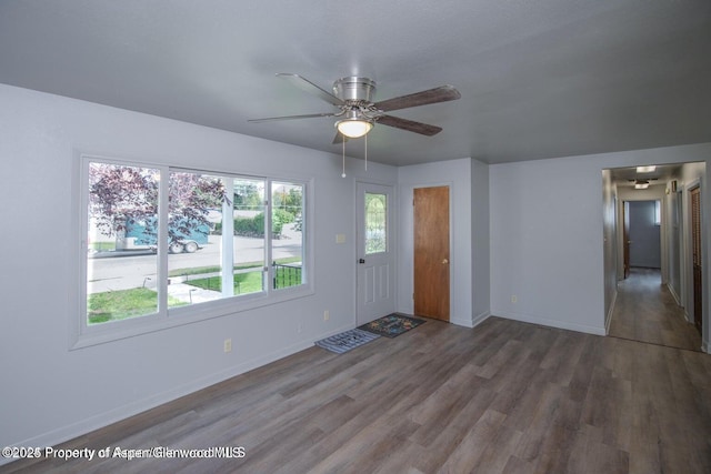 750 Breeze St, Craig, CO 81625 - unfurnished living room with wood finished floors and a ceiling fan