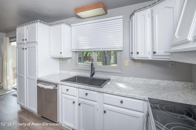 750 Breeze St, Craig, CO 81625 - kitchen featuring dishwasher, white cabinetry, dark wood-type flooring, and light stone countertops