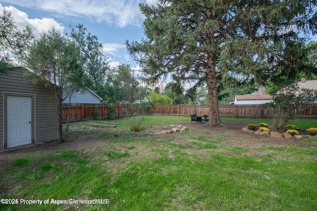 750 Breeze St, Craig, CO 81625 - fenced backyard with a storage shed
