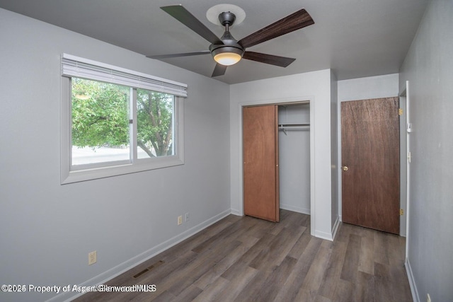 750 Breeze St, Craig, CO 81625 - unfurnished bedroom featuring wood finished floors, a closet, and a ceiling fan