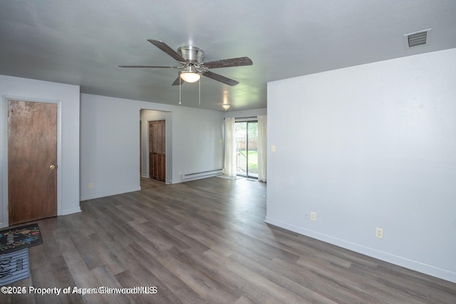 750 Breeze St, Craig, CO 81625 - spare room featuring a baseboard radiator, a ceiling fan, and wood finished floors