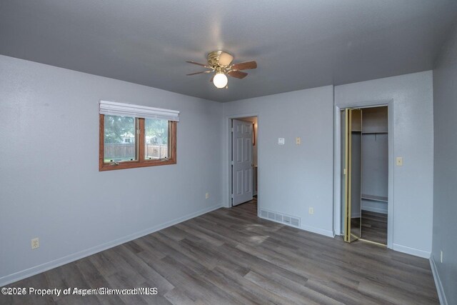750 Breeze St, Craig, CO 81625 - unfurnished bedroom featuring wood finished floors, a closet, and ceiling fan