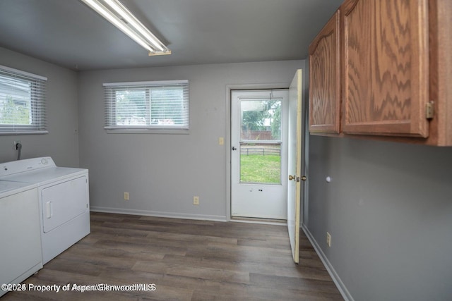 750 Breeze St, Craig, CO 81625 - washroom with cabinet space, washer and clothes dryer, wood finished floors, and plenty of natural light
