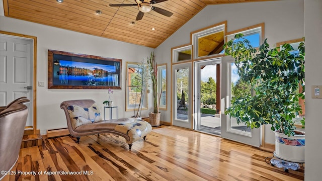 220 Sam Grange Ct, Eljebel, CO 81623 - living area with wood finished floors, wood ceiling, a baseboard heating unit, a ceiling fan, and vaulted ceiling