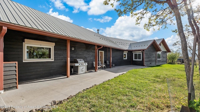 220 Sam Grange Ct, Eljebel, CO 81623 - back of house featuring a yard, a patio area, and metal roof
