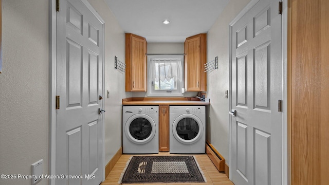 220 Sam Grange Ct, Eljebel, CO 81623 - laundry room with a baseboard radiator, washing machine and dryer, baseboards, cabinet space, and recessed lighting