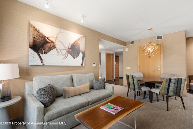 living room with an inviting chandelier