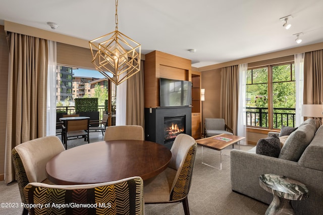 dining area with an inviting chandelier and a healthy amount of sunlight