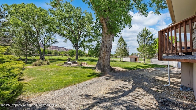 541 20 1/2 Rd, Grand Junction, CO 81507 - view of green lawn featuring a wooden deck