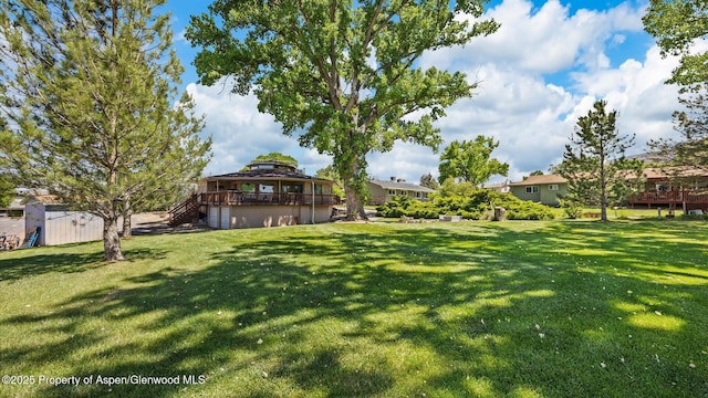 541 20 1/2 Rd, Grand Junction, CO 81507 - view of grassy yard featuring stairway and a deck