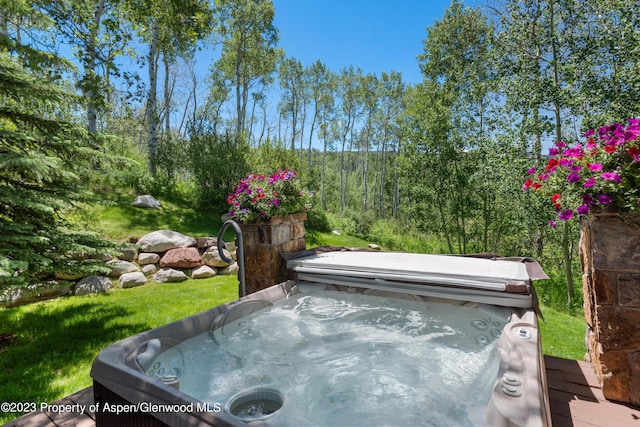 exterior space featuring a hot tub