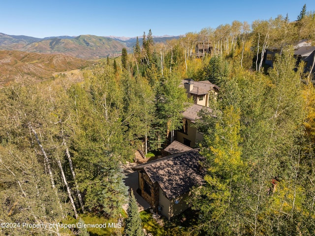 birds eye view of property with a mountain view