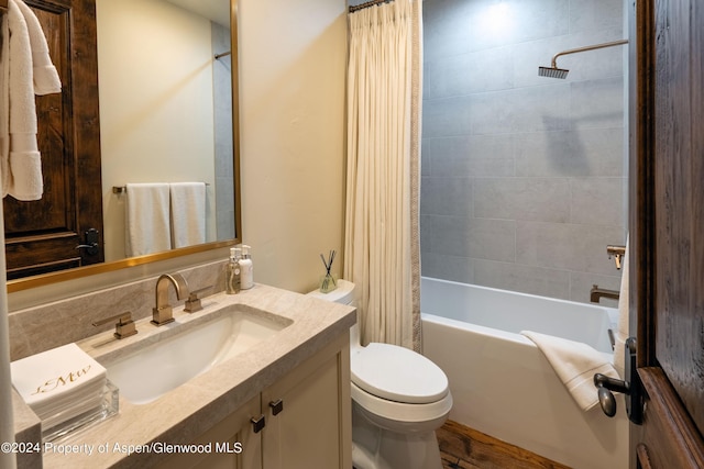 full bathroom with vanity, tasteful backsplash, toilet, and shower / bathtub combination with curtain