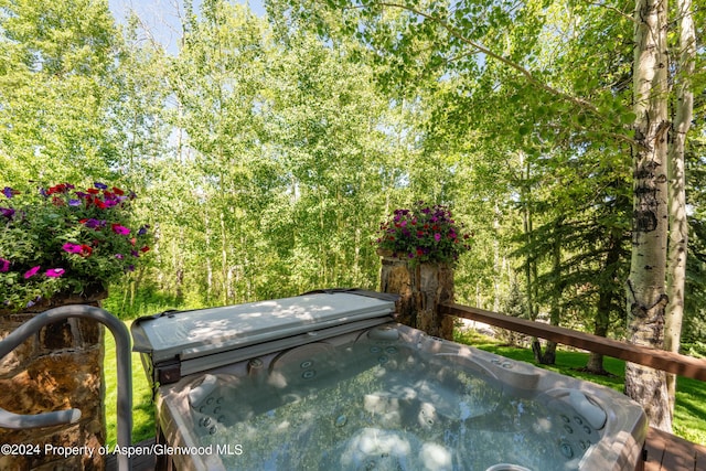 deck with a hot tub