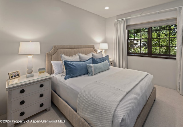 bedroom with light colored carpet