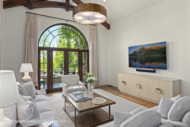 living room with french doors and light hardwood / wood-style flooring