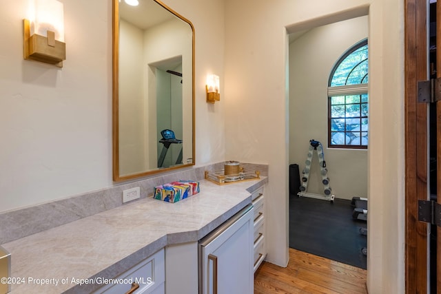 bathroom with vanity and wood-type flooring