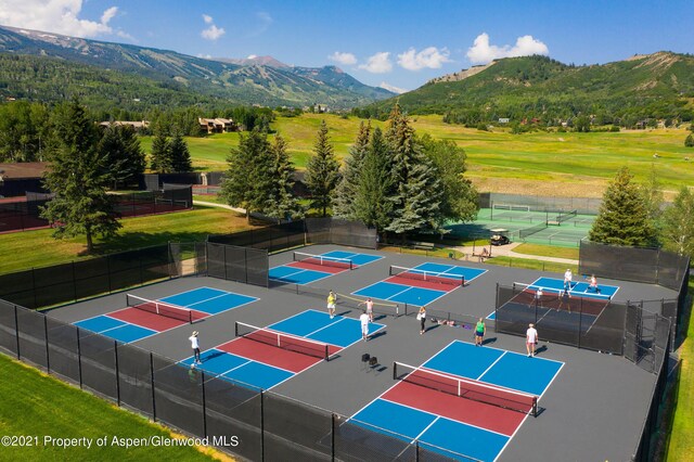 birds eye view of property featuring a mountain view