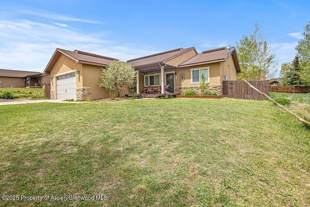 352 Lake View Rd, Hayden, CO 81639 - single story home with stone siding, stucco siding, an attached garage, and concrete driveway