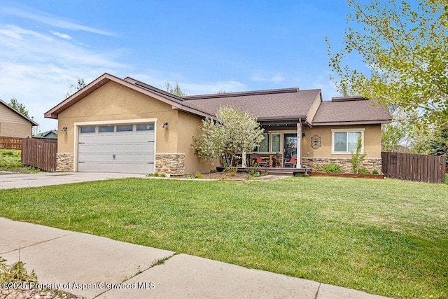 352 Lake View Rd, Hayden, CO 81639 - view of front of house with stone siding, driveway, and stucco siding