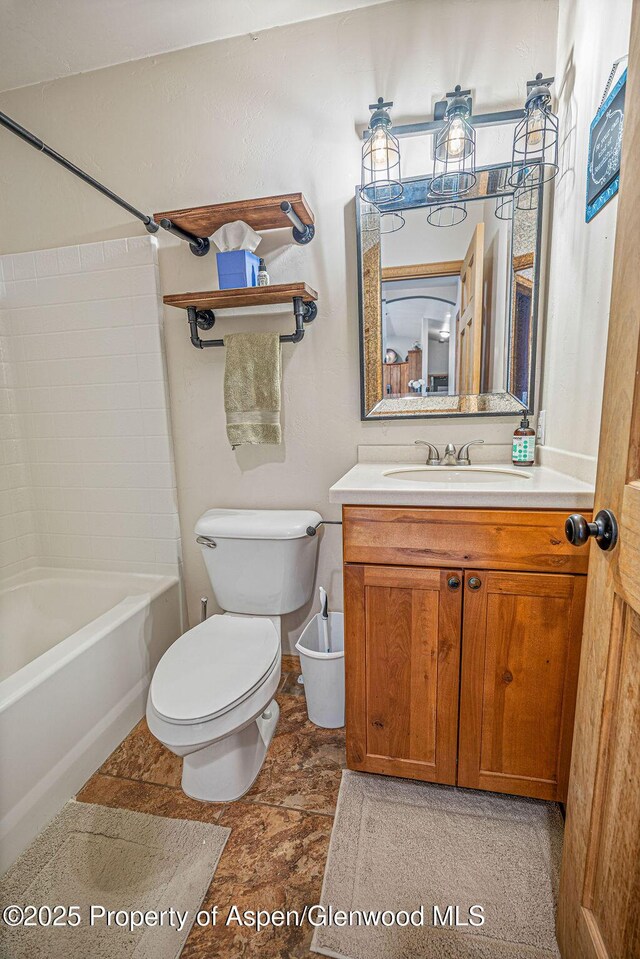 352 Lake View Rd, Hayden, CO 81639 - full bath featuring toilet, vanity, shower / bath combination, and stone finish floors