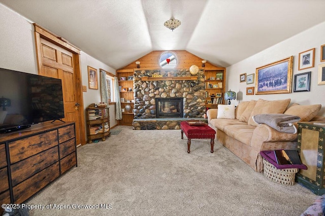 carpeted living area with vaulted ceiling, a fireplace, and built in features