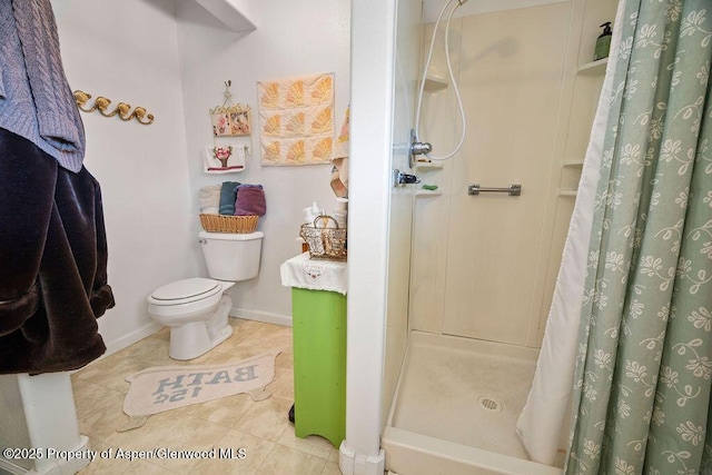 full bath with tile patterned flooring, baseboards, a shower stall, and toilet