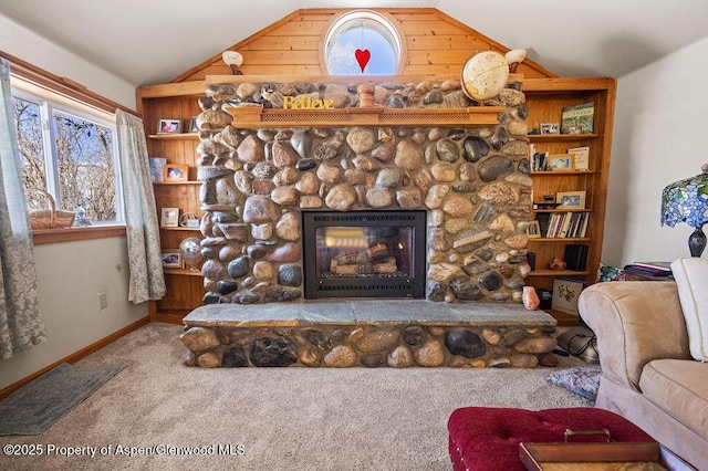 room details featuring carpet, a stone fireplace, and baseboards